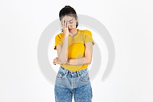 Upset stressed young Asian woman with hands on face feeling disappointed over white isolated background