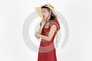 Upset stressed young Asian woman in red dress feeling in depression over white isolated background