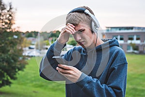 Upset teenager listening to music.