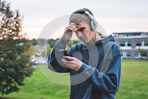 Upset teenager listening to music.