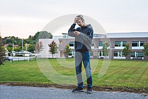 Upset teenager listening to music.