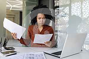 Upset and unsatisfied woman at workplace, businesswoman boss checking documents, accounts and contracts, financial woman