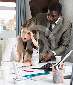 Upset woman with angry boss