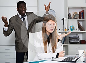 Upset woman with angry boss