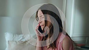 Upset woman answering mobile phone at night closeup. Unhappy sad girl crying