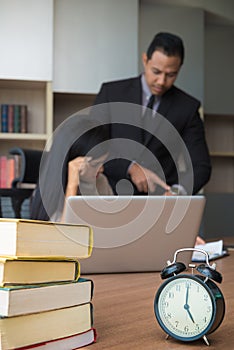 Upset woman being scolded by boss for working at office and Boss