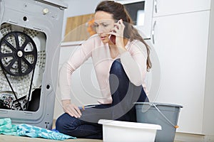 upset woman claiming insurance for washing machine leaks