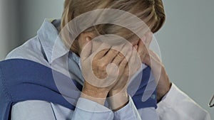 Upset woman crying from despair and hopelessness, disappointing diagnosis