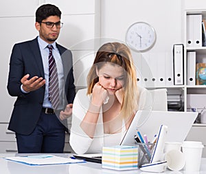 Upset woman with disgruntled boss