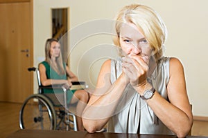 Upset woman and handicapped