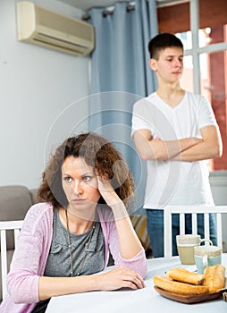 Upset woman after quarrel with teenage son
