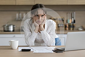 Upset woman thinking about solving financial problems