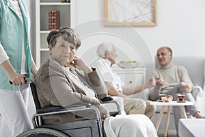 Upset woman on wheelchair