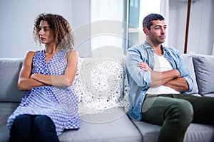 Upset young couple ignoring each other