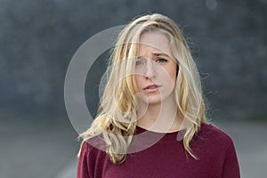 Upset young woman with a sad expression