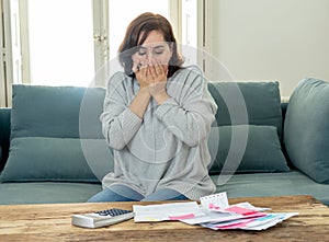 Upset young woman stressed about credit card debts and payments not happy accounting finances