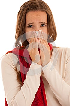 Upset young woman suffering from influenza at home