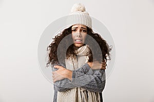 Upset young woman wearing winter scarf