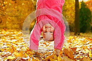 Upside down in autumnal park