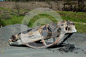 Upside down burnt-out car