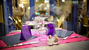 Upside down glasses on fashionably served table in modern restaurant, closeup