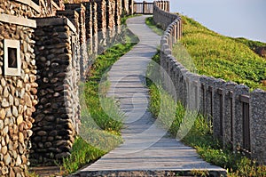 An upslope path to a sea shore hill at Hoping island, Keelung, Taiwan photo