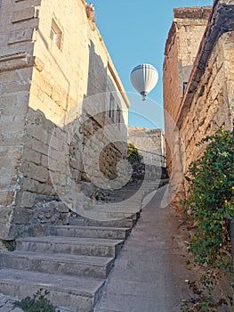 Upstairs to the light - stone stairs to the open air freedom and light with flying balloon