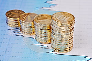 Uptrend stacks coins,on the financial stock chart