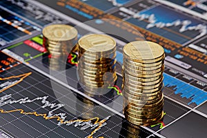 Uptrend stacks coins,on the financial stock charts photo