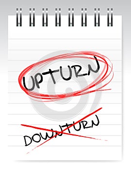 Upturn, crossed out the word downturn photo