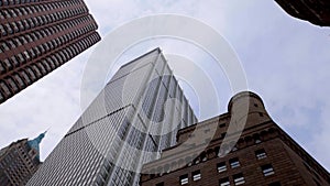 Upward rotating view of NYC buildings from Third Avenue street level