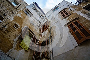 Upward view in alley in Polignano a Mare, Puglia, Italy