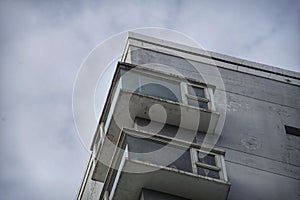 Upward view of apartment block and sky