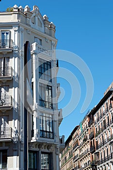 Upward view on classical vintage buildings in art deco style downtown Madrid, Spain. Spanish baroque architecture