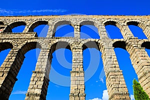 Upward view of the Roman Aqueduct of Segovia, Spain