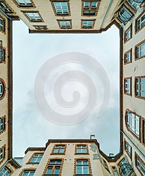 Upward view to building well in small square
