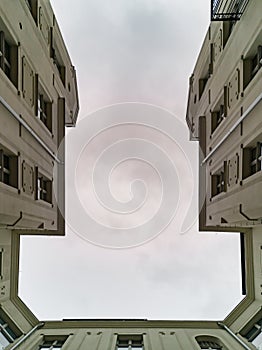 Upward view to facade of old tenement house