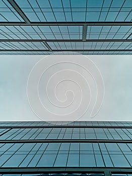 Upward view to two high corporate buildings