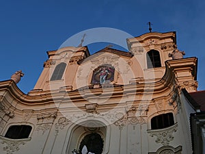 Upward view on two towers of baroque church of saint Peter and Paul in benedictine monastery of Rajhrad, Czech Republic