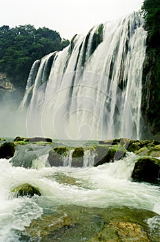 an upward view of a Waterfall