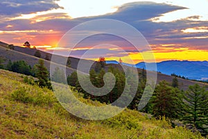 Ural mountains in summer. Sunset in the mountains. The top of the mountain range. Summer day