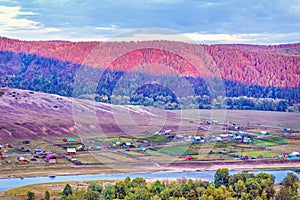 Ural village among the mountain peaks.