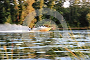 Uralsk, Kazakhstan - July 17 2014: boat with tourists at high speed floating on the river