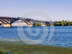 Urbain train going through the metro bridge from the right to the left bank of Dniepro river in Kyiv