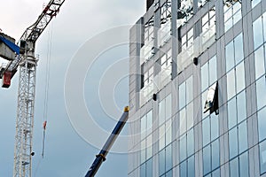 Urban abstract background, detail of modern glass facade, office business building.