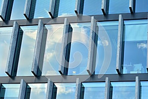 Urban abstract background, detail of modern glass facade, office business building.