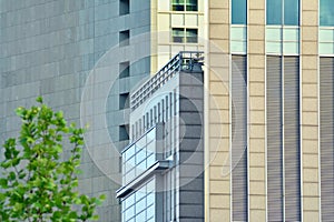 Urban abstract background, detail of modern glass facade, office business building.