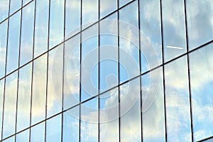 Urban abstract background, detail of modern glass facade, office business building.