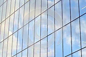 Urban abstract background, detail of modern glass facade, office business building.