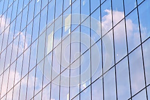 Urban abstract background, detail of modern glass facade, office business building.